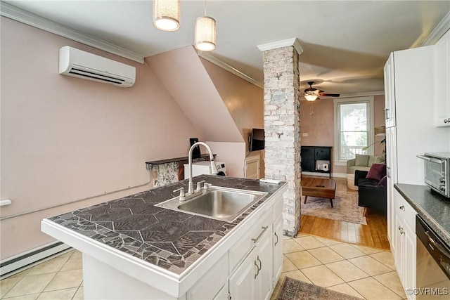 1410 W Clay St, Richmond, VA 23220 - kitchen with ornate columns, a wall mounted air conditioner, stainless steel dishwasher, a baseboard heating unit, and light tile patterned floors