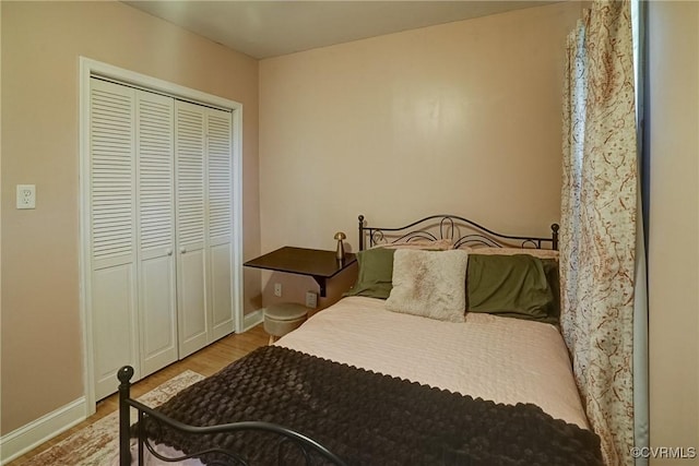 1410 W Clay St, Richmond, VA 23220 - bedroom with wood finished floors and a closet