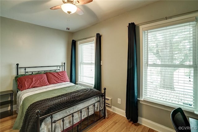 1410 W Clay St, Richmond, VA 23220 - bedroom featuring light wood-style floors, baseboard heating, and ceiling fan