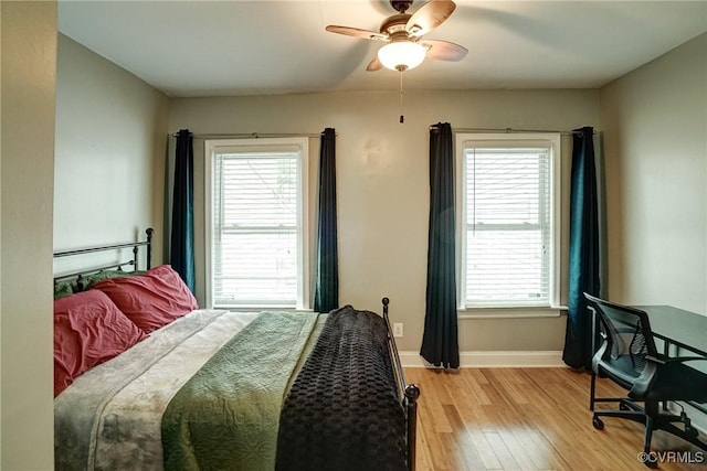 1410 W Clay St, Richmond, VA 23220 - bedroom featuring light wood finished floors, multiple windows, and a ceiling fan