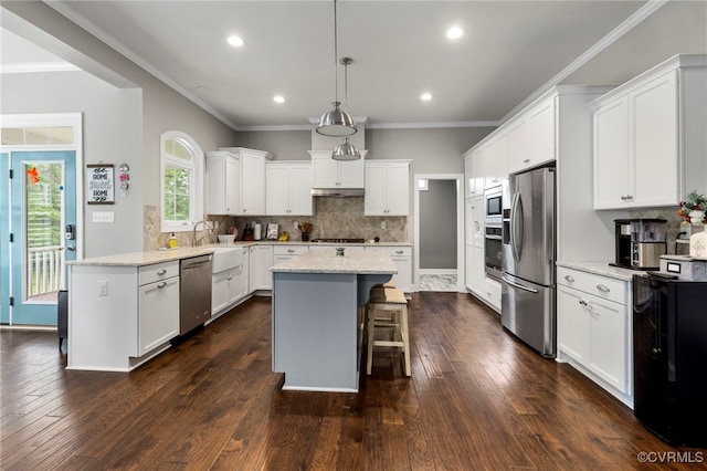 16507 Hannington Dr, Midlothian, VA 23112 - kitchen featuring appliances with stainless steel finishes, a peninsula, a center island, dark wood-style flooring, and recessed lighting