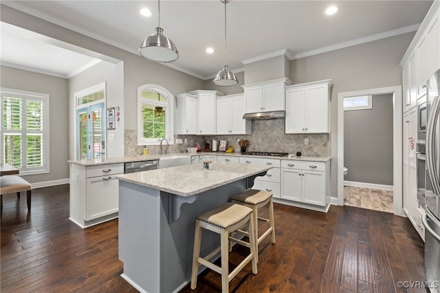 16507 Hannington Dr, Midlothian, VA 23112 - kitchen featuring a kitchen island, white cabinets, dishwasher, tasteful backsplash, and recessed lighting