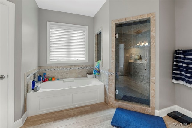 16507 Hannington Dr, Midlothian, VA 23112 - full bathroom featuring a bath, a stall shower, and wood finished floors
