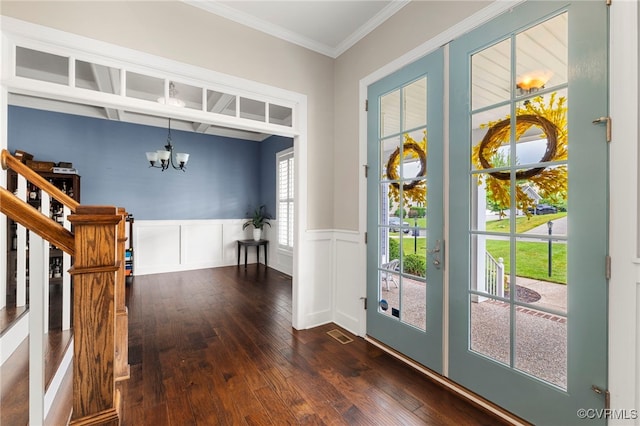 16507 Hannington Dr, Midlothian, VA 23112 - foyer featuring a chandelier, dark wood-style floors, stairway, wainscoting, and ornamental molding