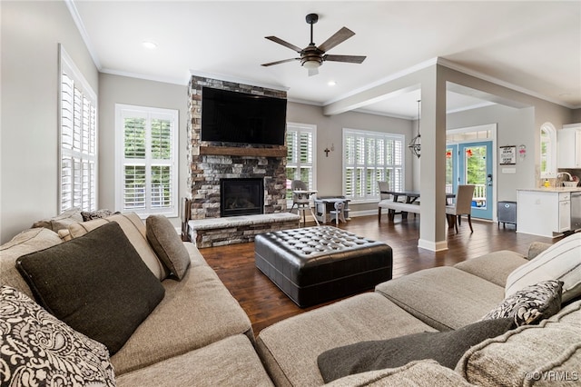 16507 Hannington Dr, Midlothian, VA 23112 - living room featuring ornamental molding, dark wood finished floors, a ceiling fan, a fireplace, and recessed lighting