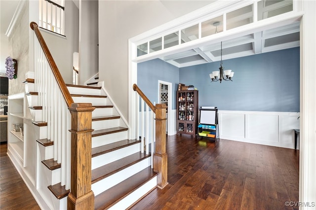 16507 Hannington Dr, Midlothian, VA 23112 - staircase featuring wood-type flooring, a towering ceiling, a chandelier, coffered ceiling, and beam ceiling