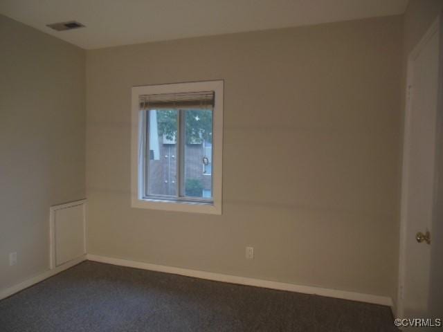 5220 Castlewood Rd Unit E, Chesterfield, VA 23234 - empty room featuring dark carpet and baseboards