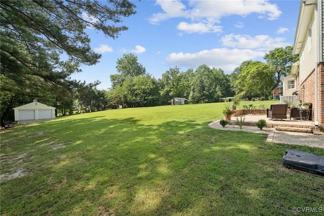 4619 Otterdale Rd, Moseley, VA 23120 - view of green lawn featuring a detached garage, a patio, and view of scattered trees