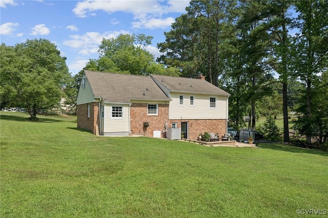 4619 Otterdale Rd, Moseley, VA 23120 - back of house with brick siding, a lawn, and a chimney