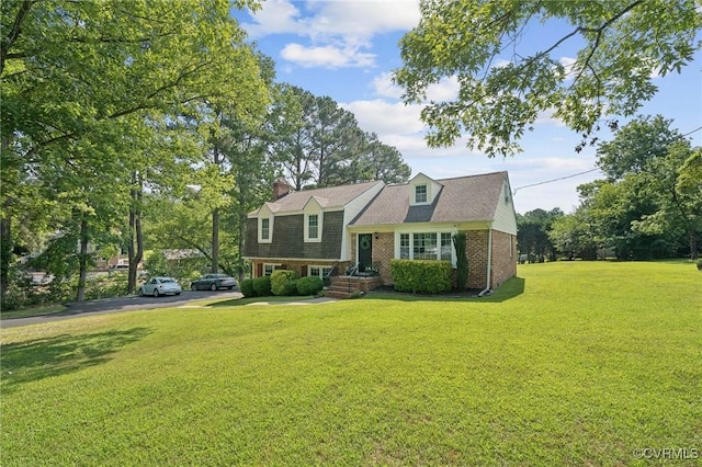 4619 Otterdale Rd, Moseley, VA 23120 - tri-level home featuring a front lawn, brick siding, and a chimney