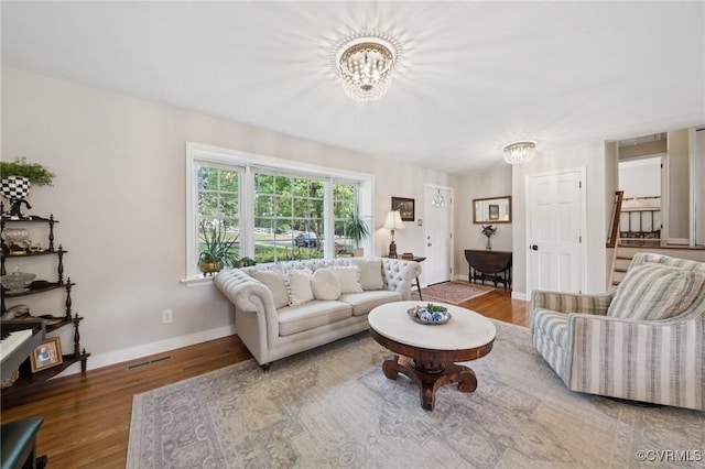 4619 Otterdale Rd, Moseley, VA 23120 - living room with a chandelier and wood finished floors