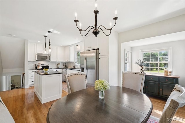 4619 Otterdale Rd, Moseley, VA 23120 - dining room with light wood-style floors, a chandelier, and recessed lighting