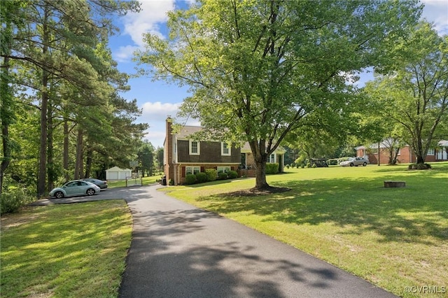 4619 Otterdale Rd, Moseley, VA 23120 - view of front of house with driveway, a chimney, and a front lawn