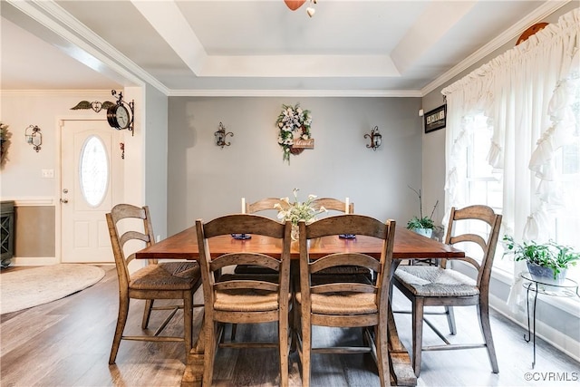 698 Quail Crossing Rd, Burkeville, VA 23922 - dining area with wood finished floors, a tray ceiling, and ornamental molding