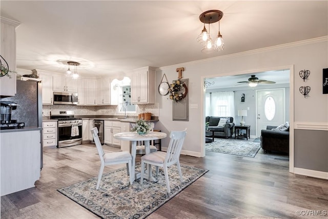 698 Quail Crossing Rd, Burkeville, VA 23922 - dining area with ceiling fan, light wood-type flooring, and crown molding