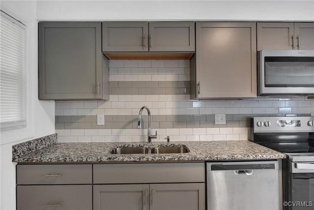 2924 Glenan Dr, Richmond, VA 23234 - kitchen featuring stainless steel appliances, gray cabinets, and decorative backsplash