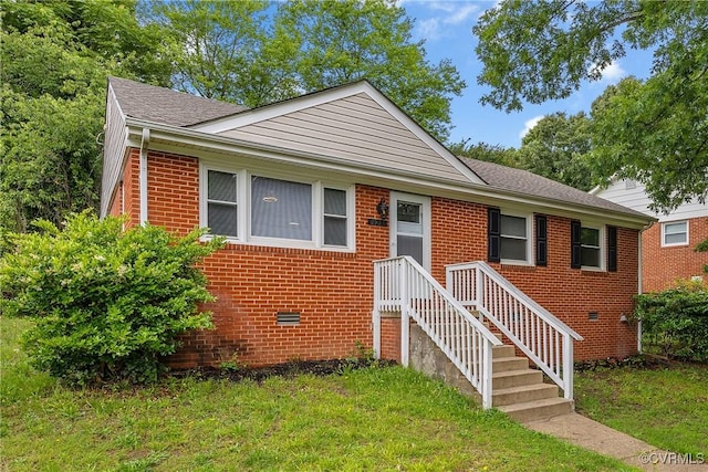 2924 Glenan Dr, Richmond, VA 23234 - view of front of property with brick siding, a front yard, and a shingled roof