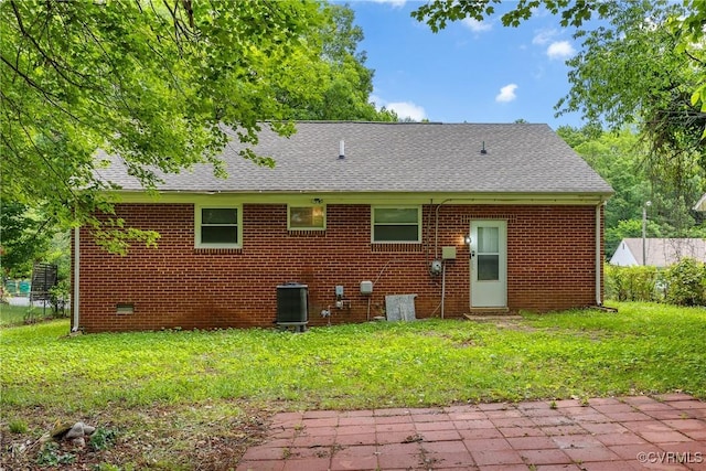 2924 Glenan Dr, Richmond, VA 23234 - back of property with roof with shingles, brick siding, and a yard