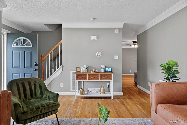 5019 Misty Spring Dr, Midlothian, VA 23112 - living area featuring a ceiling fan, stairs, crown molding, a textured ceiling, and wood finished floors