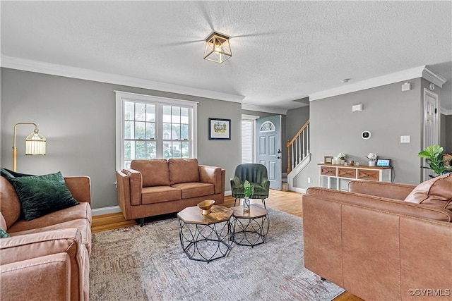 5019 Misty Spring Dr, Midlothian, VA 23112 - living room with light wood-type flooring, ornamental molding, stairway, and a textured ceiling