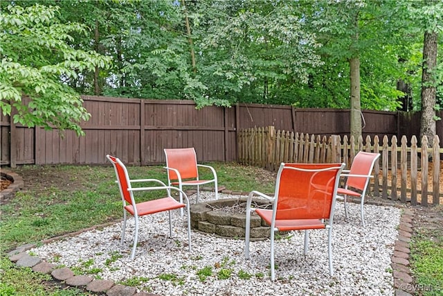 5019 Misty Spring Dr, Midlothian, VA 23112 - fenced backyard with an outdoor fire pit