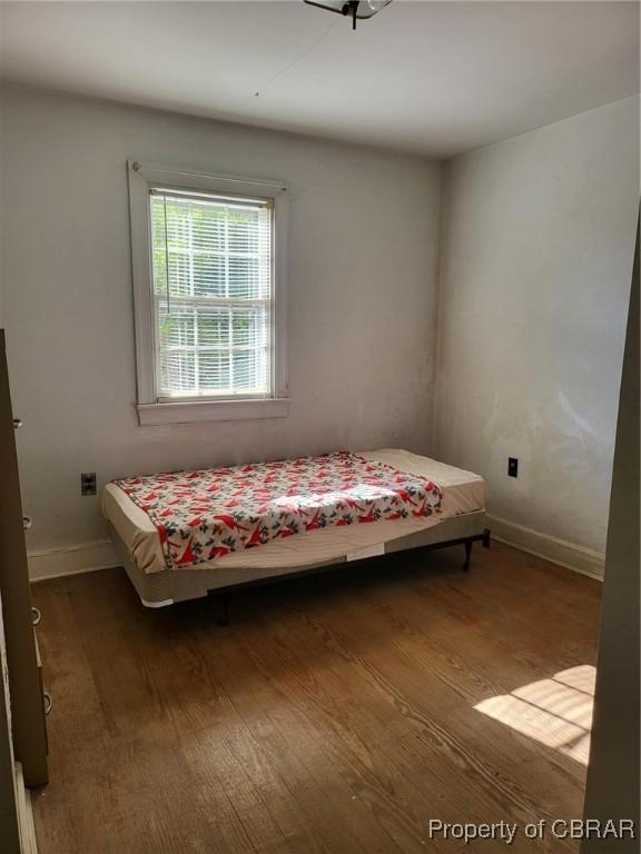122 Longhill Rd, Williamsburg, VA 23185 - bedroom featuring wood finished floors and baseboards