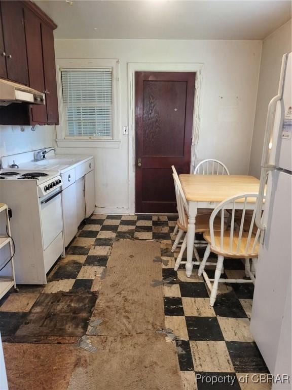 122 Longhill Rd, Williamsburg, VA 23185 - kitchen with white appliances, tile patterned floors, under cabinet range hood, and light countertops