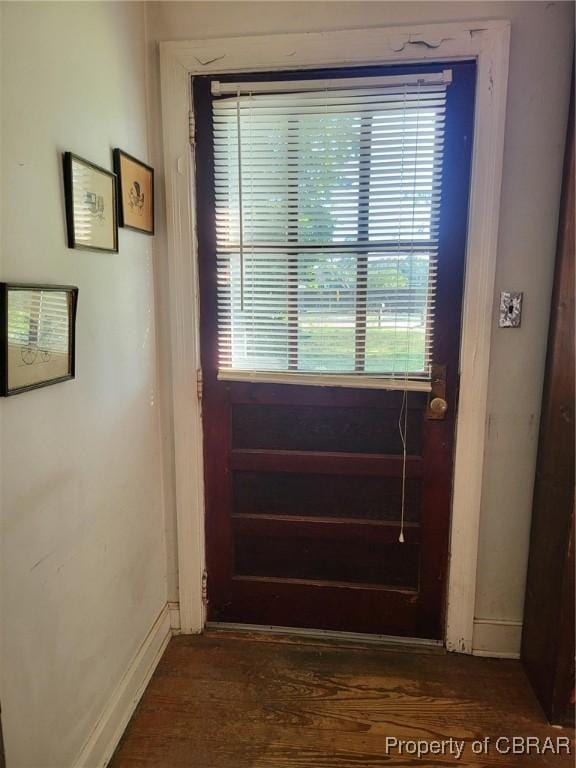 122 Longhill Rd, Williamsburg, VA 23185 - doorway to outside with dark wood finished floors and baseboards