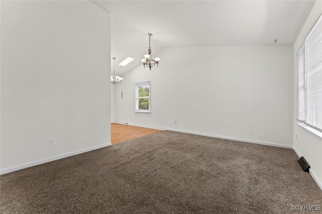 7470 Old Grove Gln, Mechanicsville, VA 23111 - carpeted empty room with a chandelier and vaulted ceiling