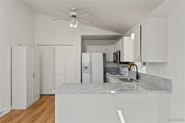7470 Old Grove Gln, Mechanicsville, VA 23111 - kitchen with white appliances, vaulted ceiling, light stone countertops, a peninsula, and white cabinets