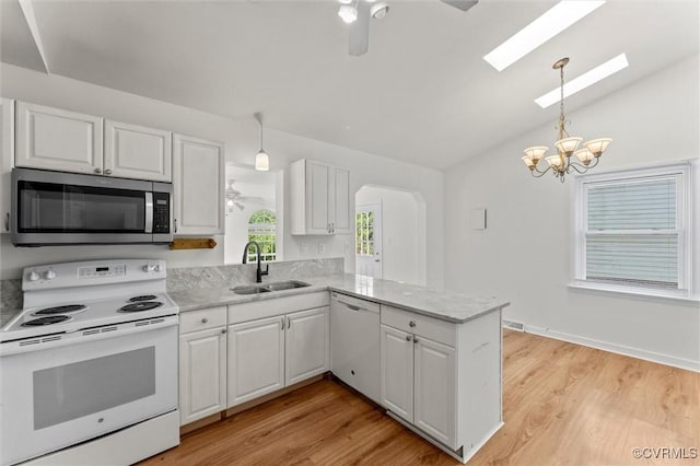 7470 Old Grove Gln, Mechanicsville, VA 23111 - kitchen featuring white appliances, white cabinetry, a chandelier, and vaulted ceiling