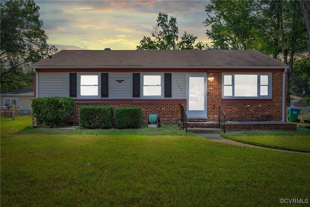 1007 Bolton Rd, Richmond, VA 23225 - ranch-style house featuring brick siding, a lawn, and entry steps