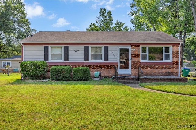 1007 Bolton Rd, Richmond, VA 23225 - view of front of home featuring brick siding, a front lawn, and entry steps