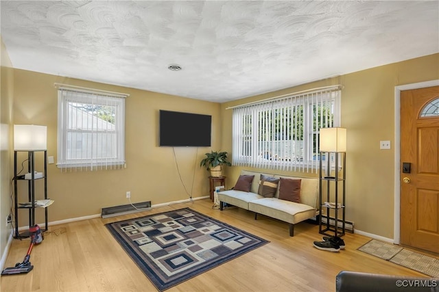 1007 Bolton Rd, Richmond, VA 23225 - living room featuring wood finished floors and a textured ceiling