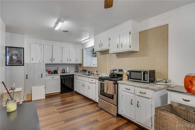 1007 Bolton Rd, Richmond, VA 23225 - kitchen with stainless steel appliances, light countertops, white cabinets, dark wood-type flooring, and decorative backsplash