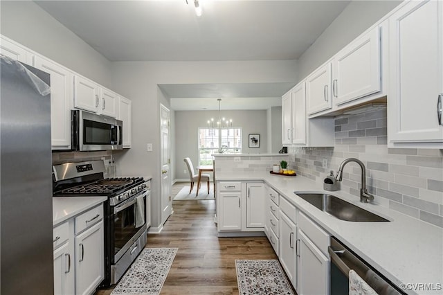 11405 Friars Walk Ct, Glen Allen, VA 23059 - kitchen with appliances with stainless steel finishes, a chandelier, tasteful backsplash, and light countertops