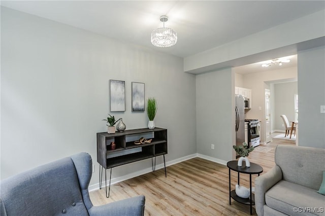 11405 Friars Walk Ct, Glen Allen, VA 23059 - living room featuring a chandelier and light wood-style flooring