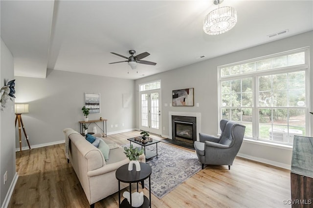 11405 Friars Walk Ct, Glen Allen, VA 23059 - living room featuring healthy amount of natural light, wood finished floors, and a glass covered fireplace