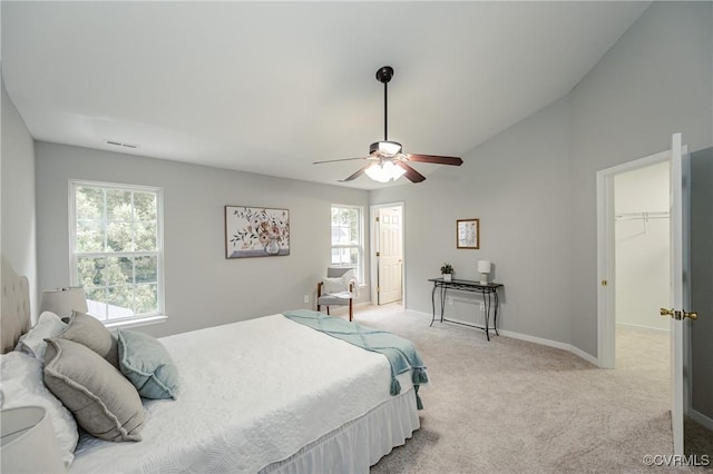 11405 Friars Walk Ct, Glen Allen, VA 23059 - bedroom with multiple windows, light colored carpet, a ceiling fan, a walk in closet, and vaulted ceiling