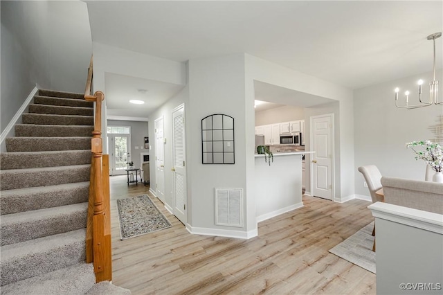 11405 Friars Walk Ct, Glen Allen, VA 23059 - entrance foyer featuring light wood finished floors, a chandelier, and stairway