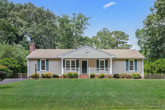 1915 Bogese Dr, Petersburg, VA 23805 - ranch-style house featuring covered porch, a chimney, a shingled roof, and view of wooded area
