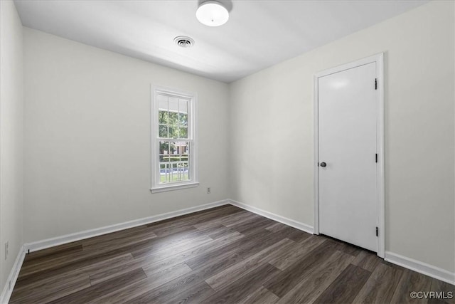 1915 Bogese Dr, Petersburg, VA 23805 - empty room featuring dark wood-style floors and baseboards