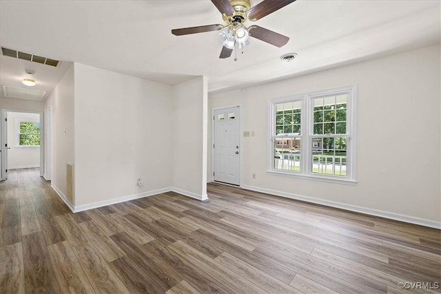 1915 Bogese Dr, Petersburg, VA 23805 - empty room with wood finished floors, a ceiling fan, and attic access