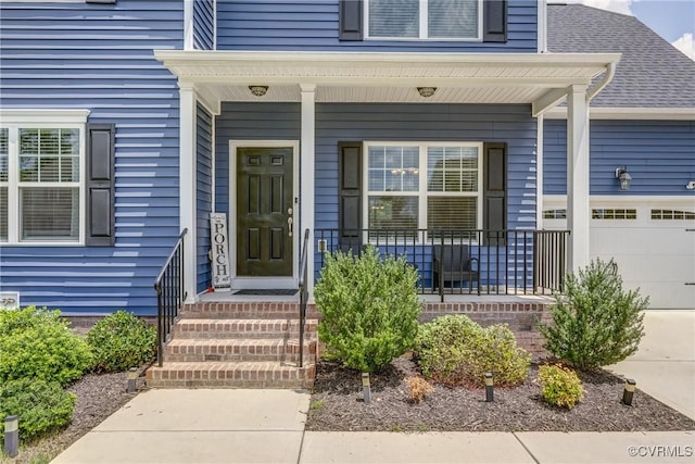 6989 Sir Galahad Rd, Henrico, VA 23231 - entrance to property with covered porch, a garage, and a shingled roof