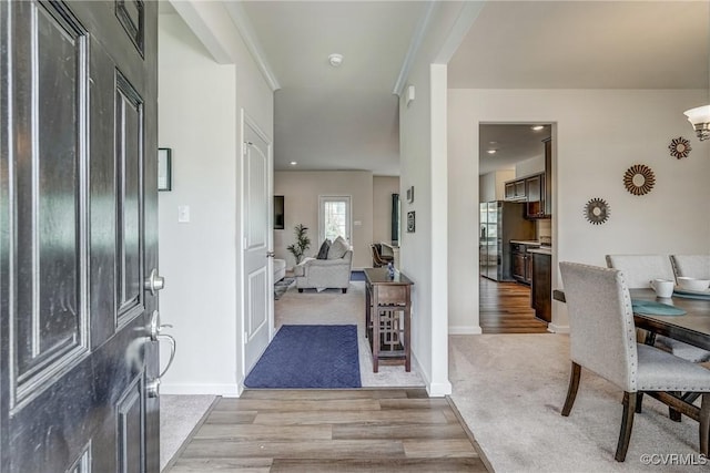 6989 Sir Galahad Rd, Henrico, VA 23231 - entrance foyer with light wood-style flooring and light carpet
