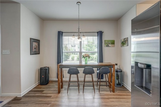 6989 Sir Galahad Rd, Henrico, VA 23231 - dining room with wood finished floors and a chandelier
