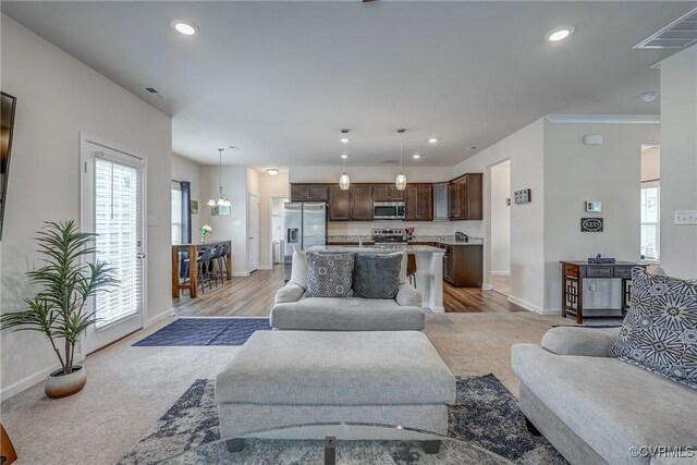 6989 Sir Galahad Rd, Henrico, VA 23231 - living area with light colored carpet, recessed lighting, and crown molding