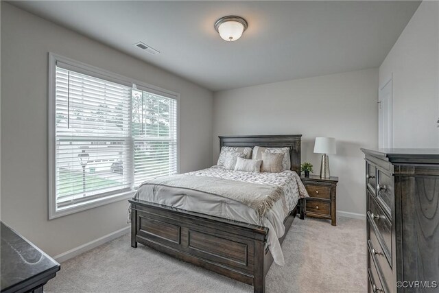 6989 Sir Galahad Rd, Henrico, VA 23231 - bedroom featuring multiple windows and light colored carpet
