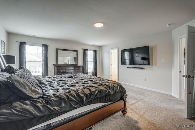 6989 Sir Galahad Rd, Henrico, VA 23231 - carpeted bedroom featuring multiple windows