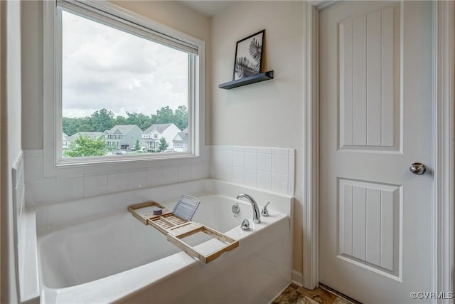 6989 Sir Galahad Rd, Henrico, VA 23231 - bathroom with plenty of natural light and a garden tub